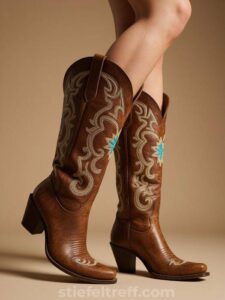 Braune Cowboyboots aus Leder mit türkisfarbenen Stickereien und abgeschrägten Absätzen